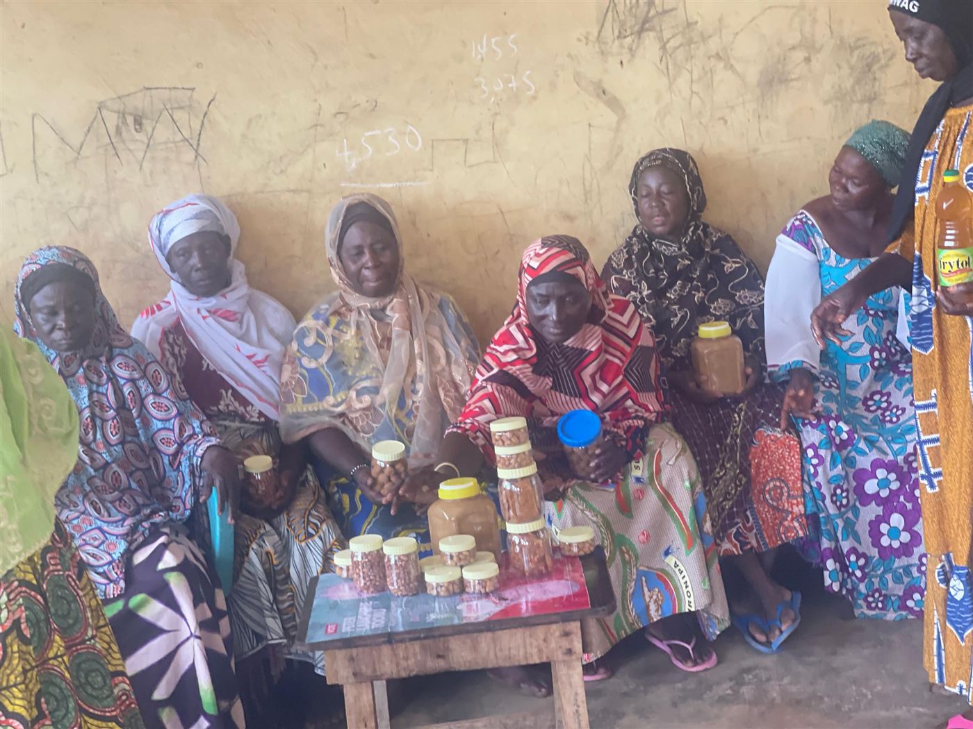 Women's group seated around a table of Influx products